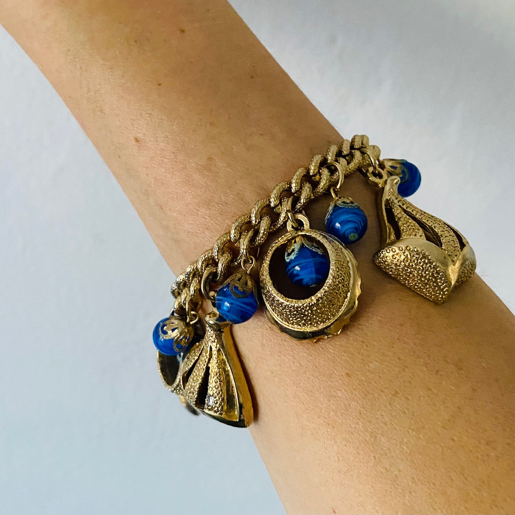 Vintage Gold Tone Blue Glass Loaded Charm Bracelet