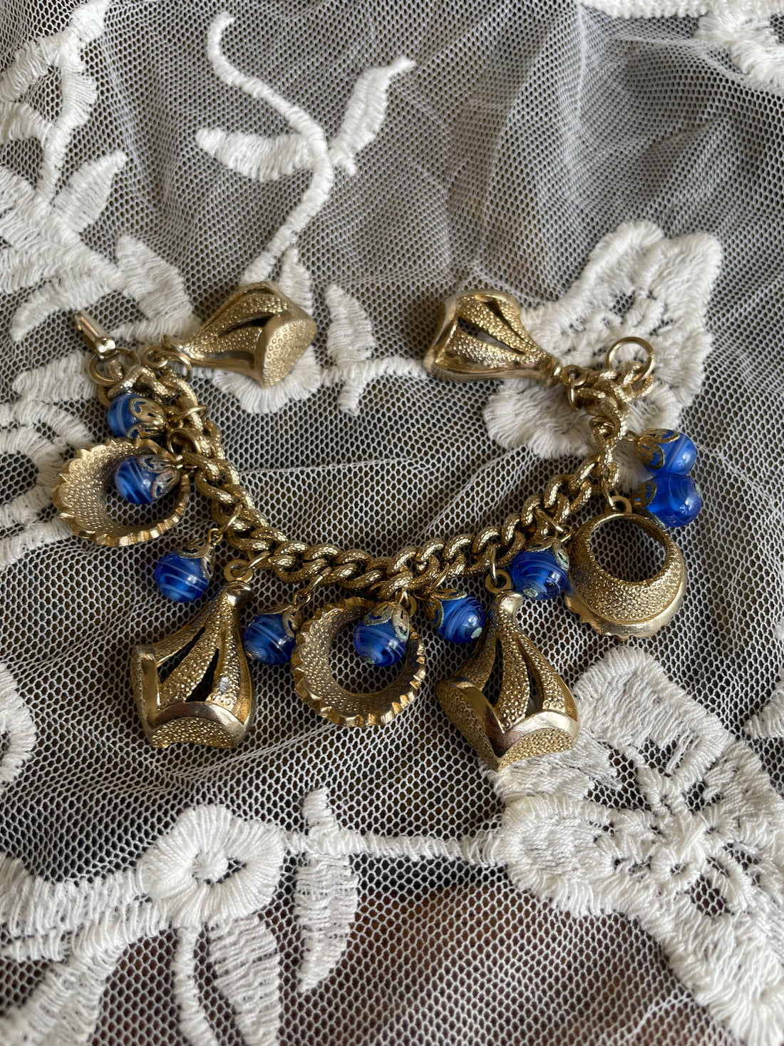 Vintage Gold Tone Blue Glass Loaded Charm Bracelet