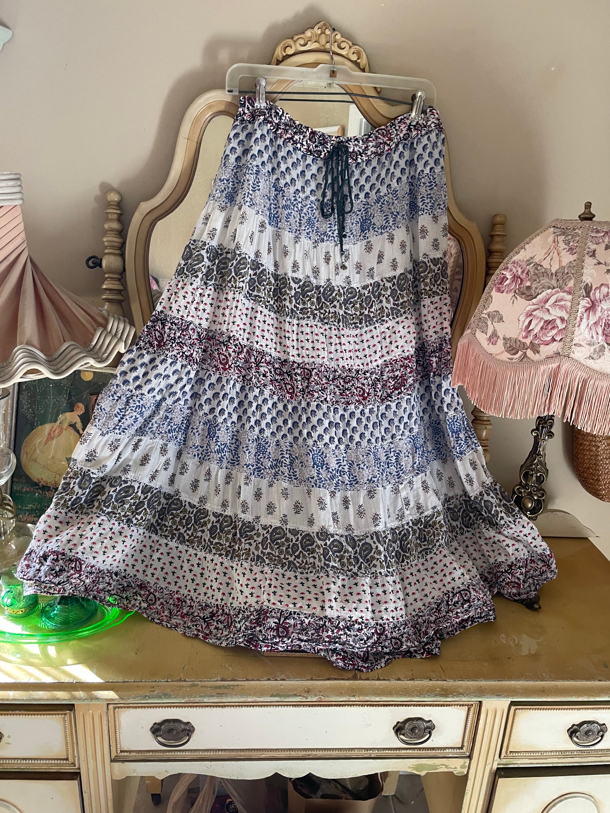 Vintage-style dress with intricate patterns on a decorative surface