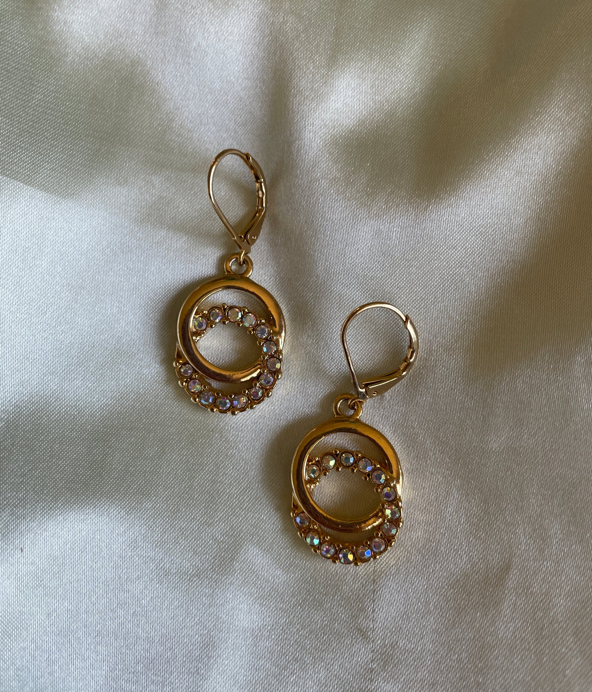 Gold tone hoop pierced earrings  2000s Gold Tone Double Circle Iridescent Crystal Lever Back Pierced Earrings